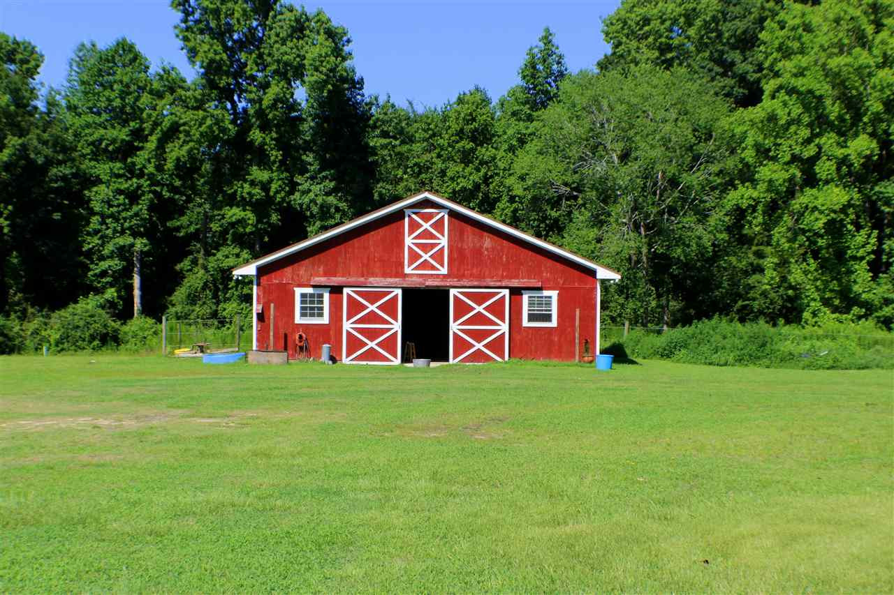 This 1,296 Square Foot Barn has it all! Four 12 by 12 Stalls, Tack Room, wash pit, hot & cold water, Washing Machine, refrigerator, and much more! Stable/Barn