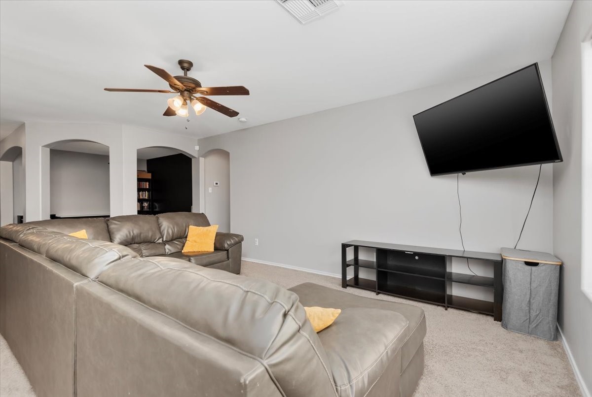 12716 Rio Lindo Street Rosharon, TX 77583 - Photo 11 of 17 a living room with furniture and a flat screen tv