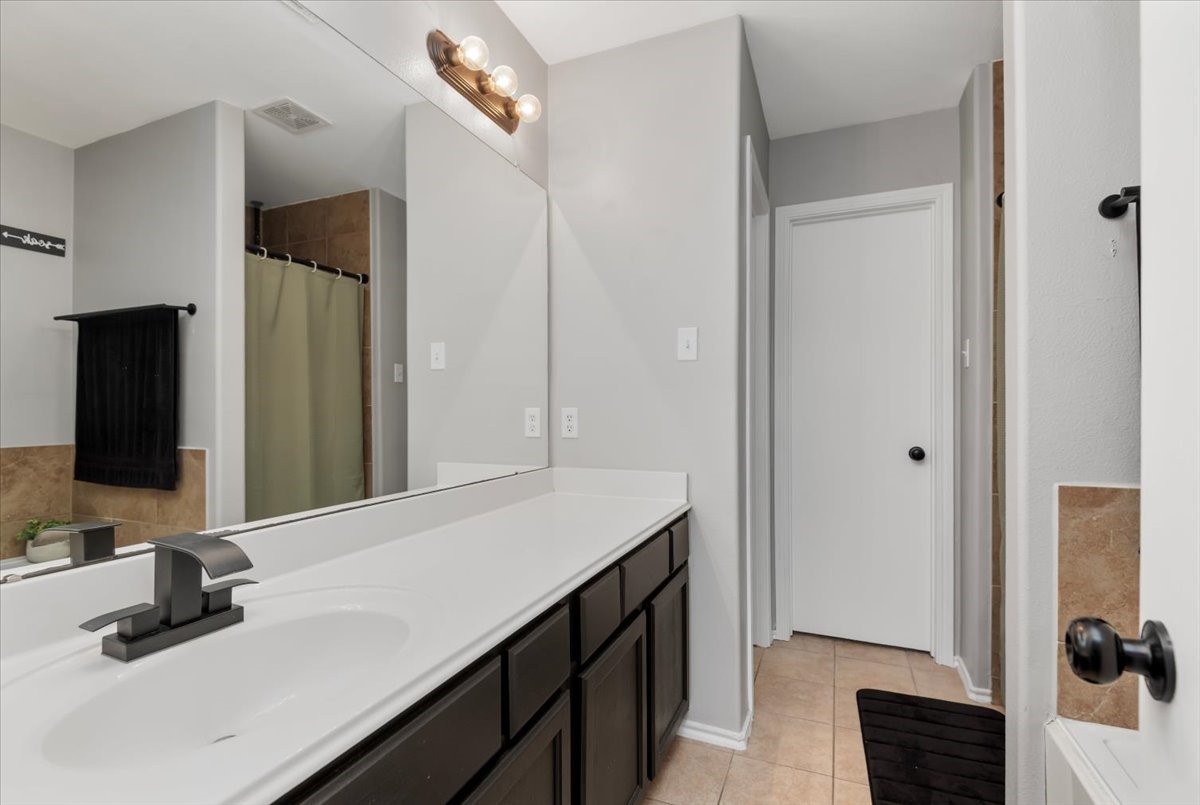 12716 Rio Lindo Street Rosharon, TX 77583 - Photo 14 of 17 a bathroom with a sink a vanity and a mirror