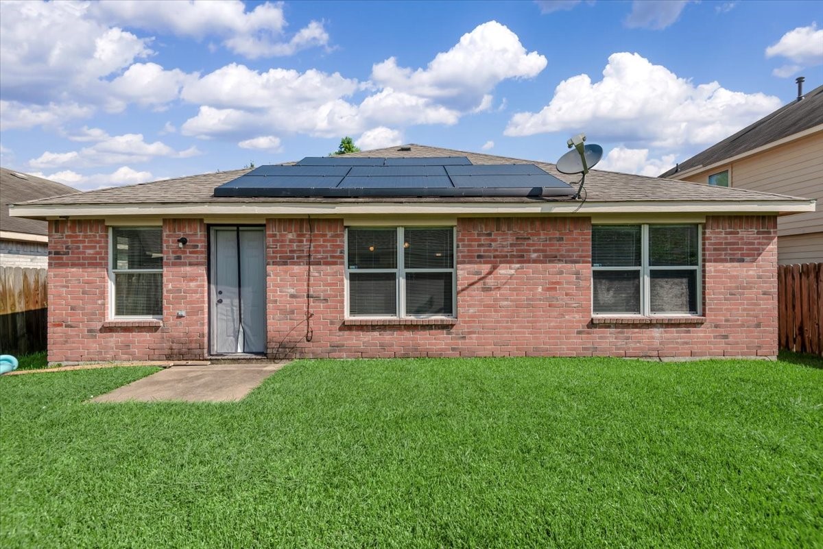 12716 Rio Lindo Street Rosharon, TX 77583 - Photo 15 of 17 front view of a brick house with a yard