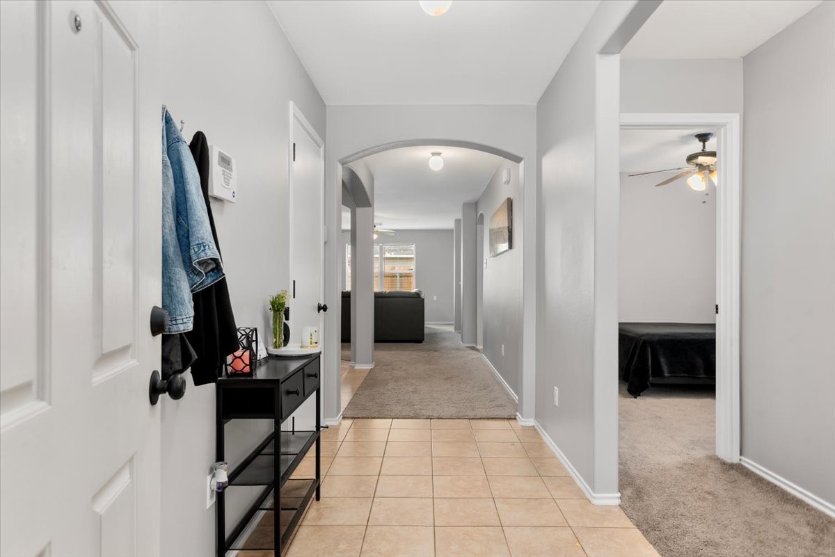 12716 Rio Lindo Street Rosharon, TX 77583 - Photo 2 of 17 a view of a hallway with the entryway and livingroom