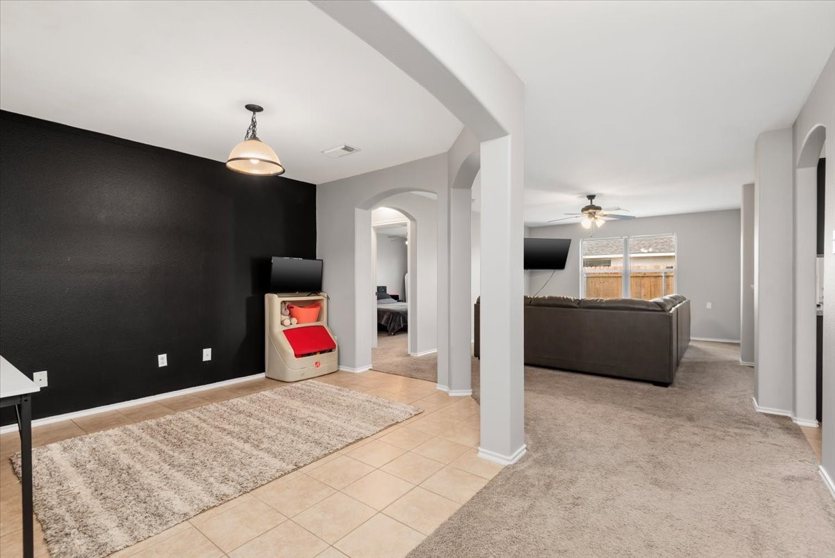 12716 Rio Lindo Street Rosharon, TX 77583 - Photo 7 of 17 a living room with furniture and a flat screen tv