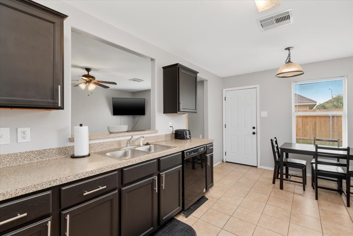 12716 Rio Lindo Street Rosharon, TX 77583 - Photo 8 of 17 a spacious bathroom with a granite countertop sink a mirror and a bathtub