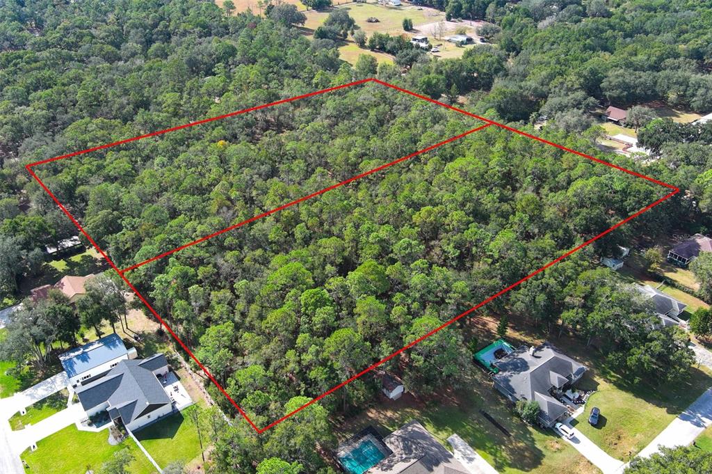 Rolling Ares Road West Lady Lake, FL 32159 - Photo 15 of 21 an aerial view of a houses with a yard and street