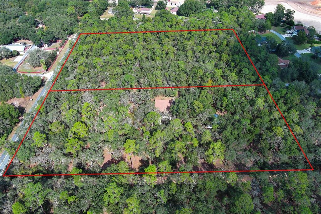 Rolling Ares Road West Lady Lake, FL 32159 - Photo 21 of 21 an aerial view of residential house with outdoor space and trees all around