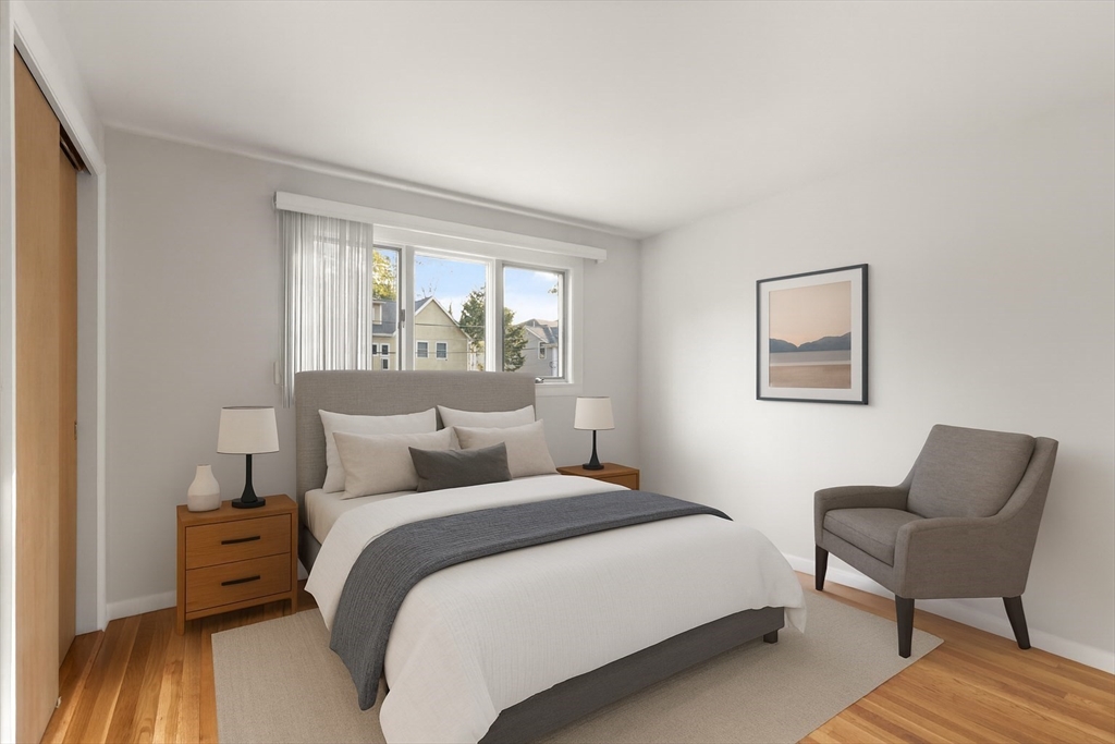 19 Selwyn Road Newton, MA 02461 - Photo 15 of 23 a bedroom with a bed and a chair