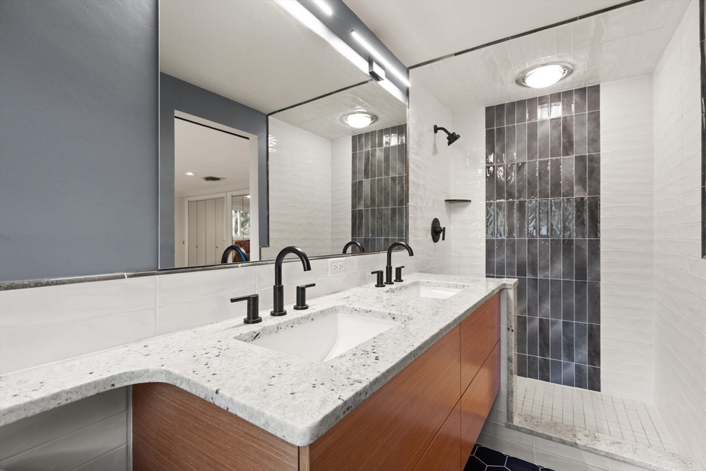 19 Selwyn Road Newton, MA 02461 - Photo 16 of 23 a bathroom with a sink double vanity and a shower