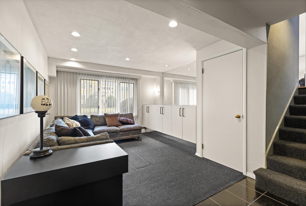 19 Selwyn Road Newton, MA 02461 - Photo 17 of 23 a living room with furniture and large windows