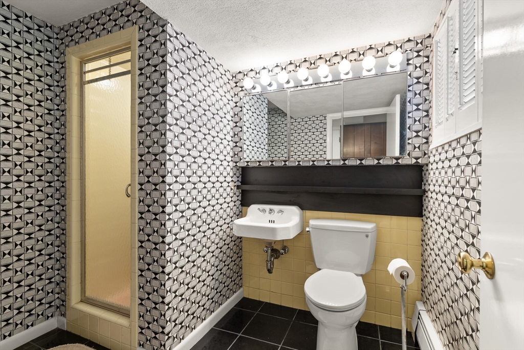 19 Selwyn Road Newton, MA 02461 - Photo 20 of 23 a bathroom with a toilet and a sink