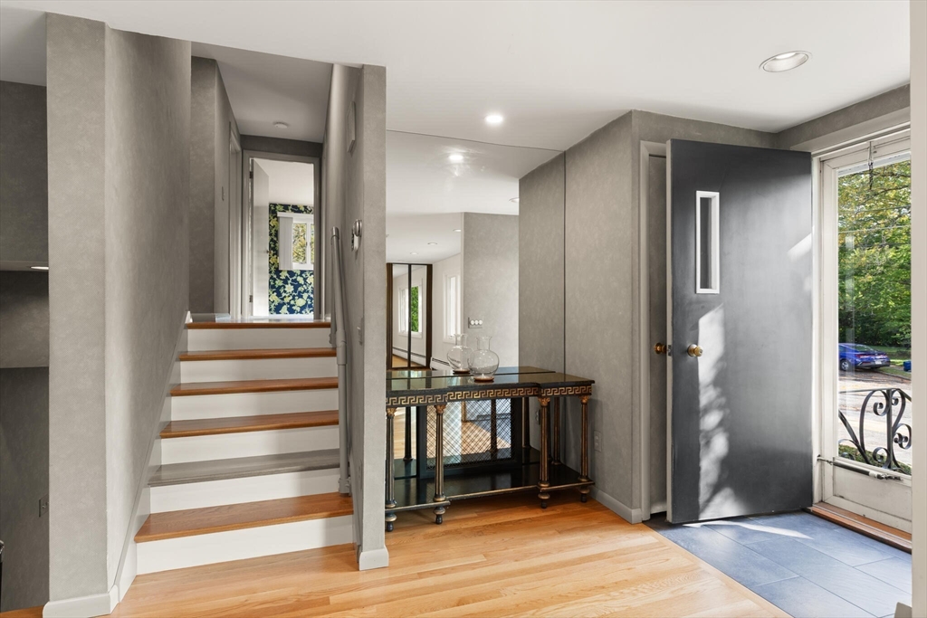 19 Selwyn Road Newton, MA 02461 - Photo 7 of 23 a view of a livingroom with wooden floor and stairs
