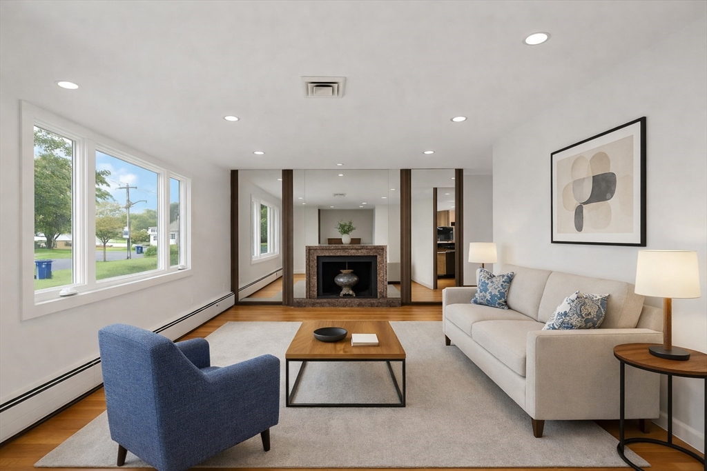 19 Selwyn Road Newton, MA 02461 - Photo 9 of 23 a living room with furniture windows and a fireplace