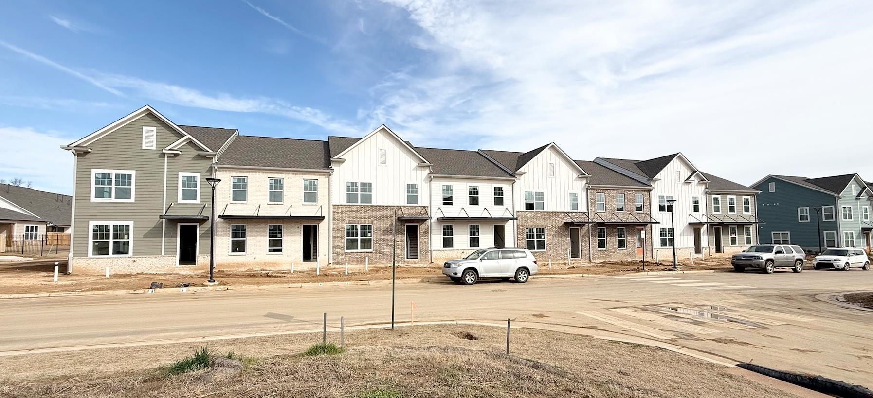 View of road featuring a residential view and curbs