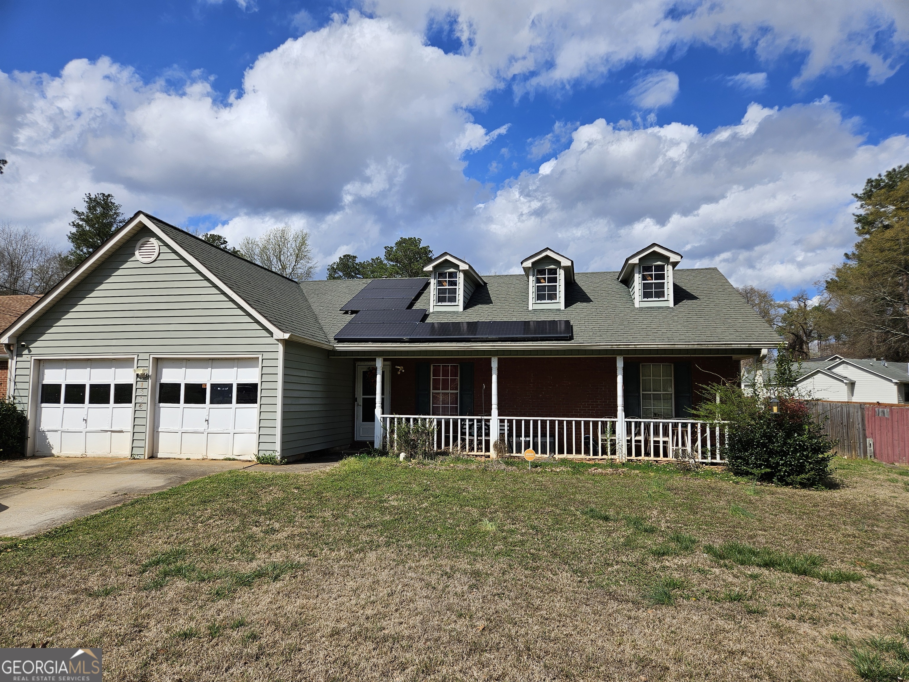 1596 Bonanza Church Road Jonesboro, GA 30236 - Photo 1 of 30 a front view of a house with a garden