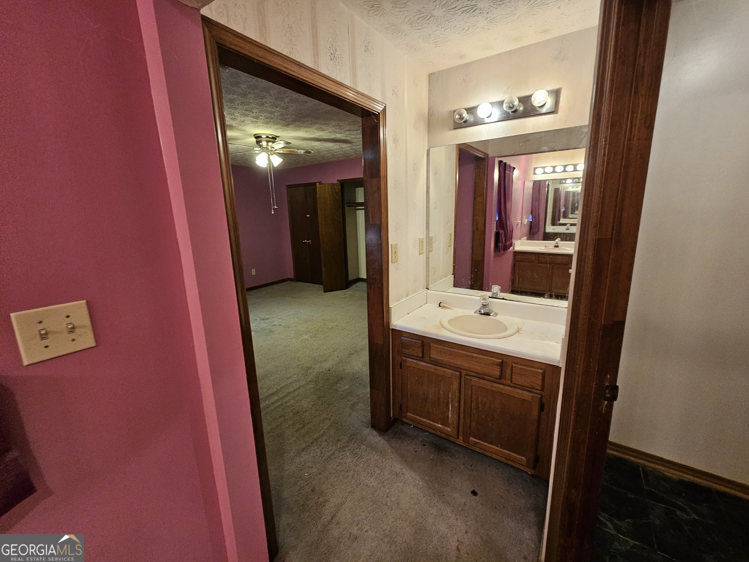 1596 Bonanza Church Road Jonesboro, GA 30236 - Photo 17 of 30 a bathroom with a sink and mirror