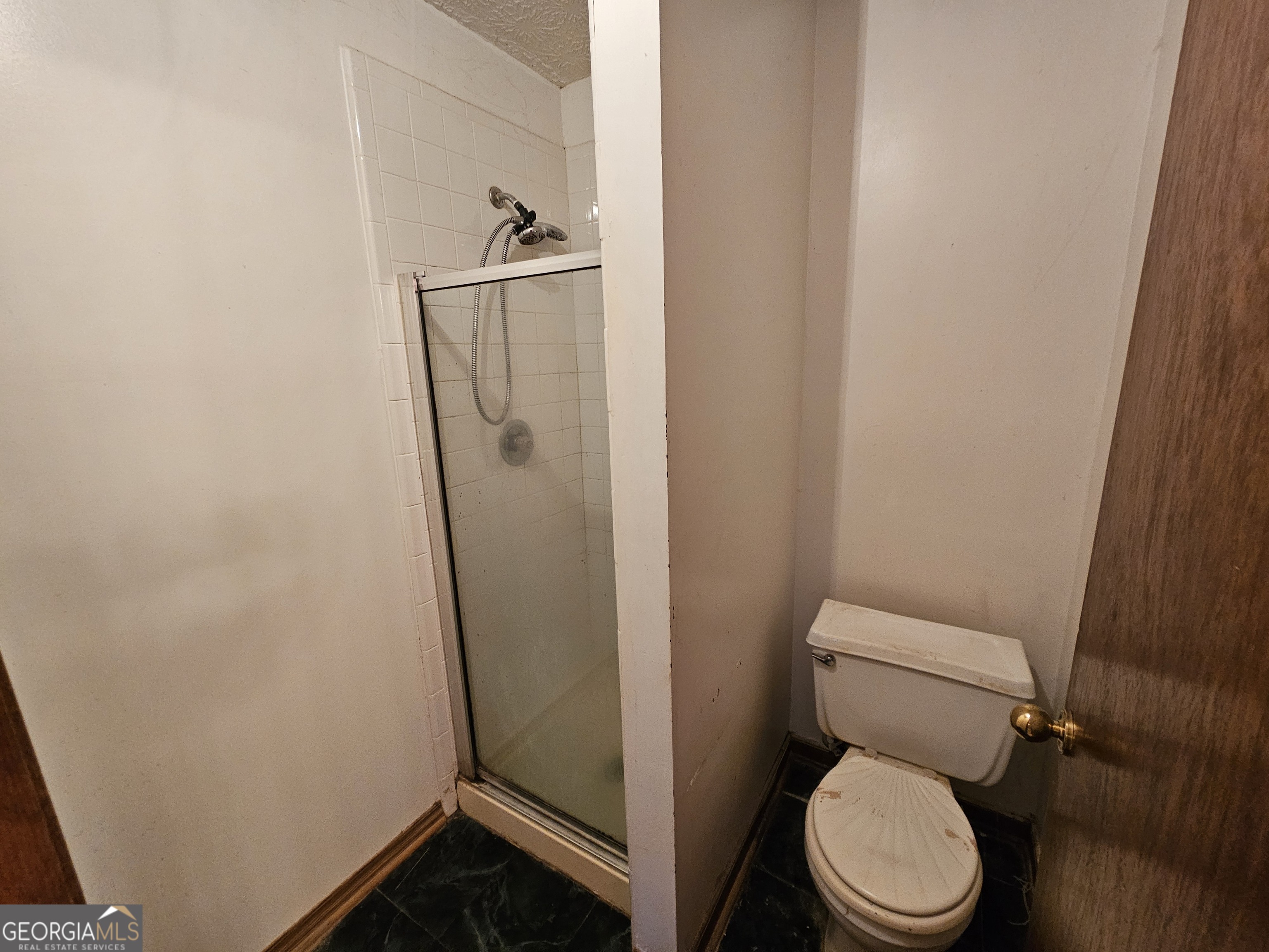 1596 Bonanza Church Road Jonesboro, GA 30236 - Photo 19 of 30 a white toilet sitting next to a shower