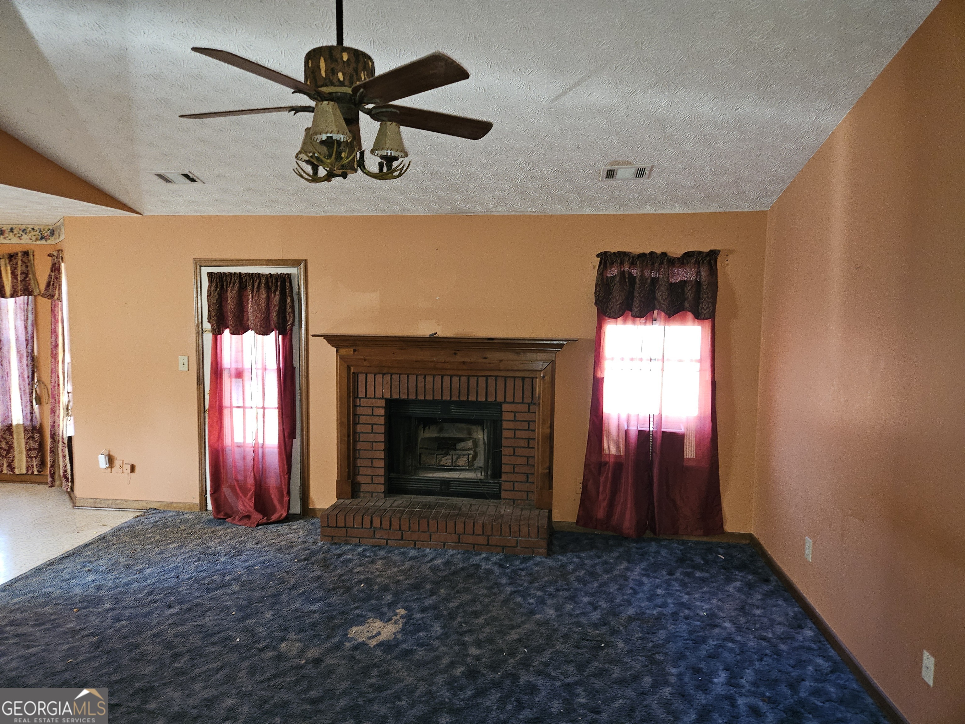 1596 Bonanza Church Road Jonesboro, GA 30236 - Photo 2 of 30 a view of an empty room with a fireplace