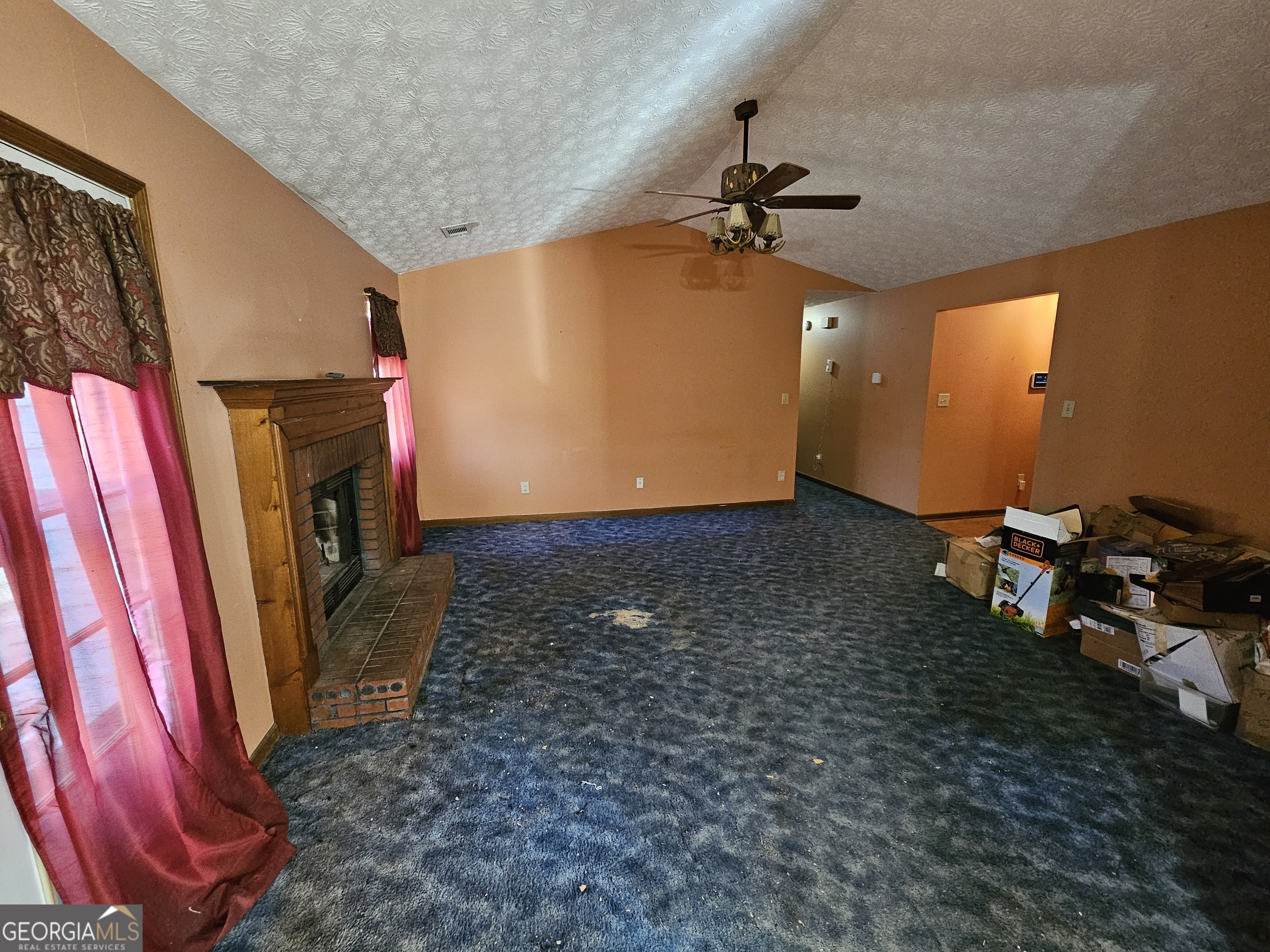 1596 Bonanza Church Road Jonesboro, GA 30236 - Photo 5 of 30 a view of a livingroom with furniture and a fireplace