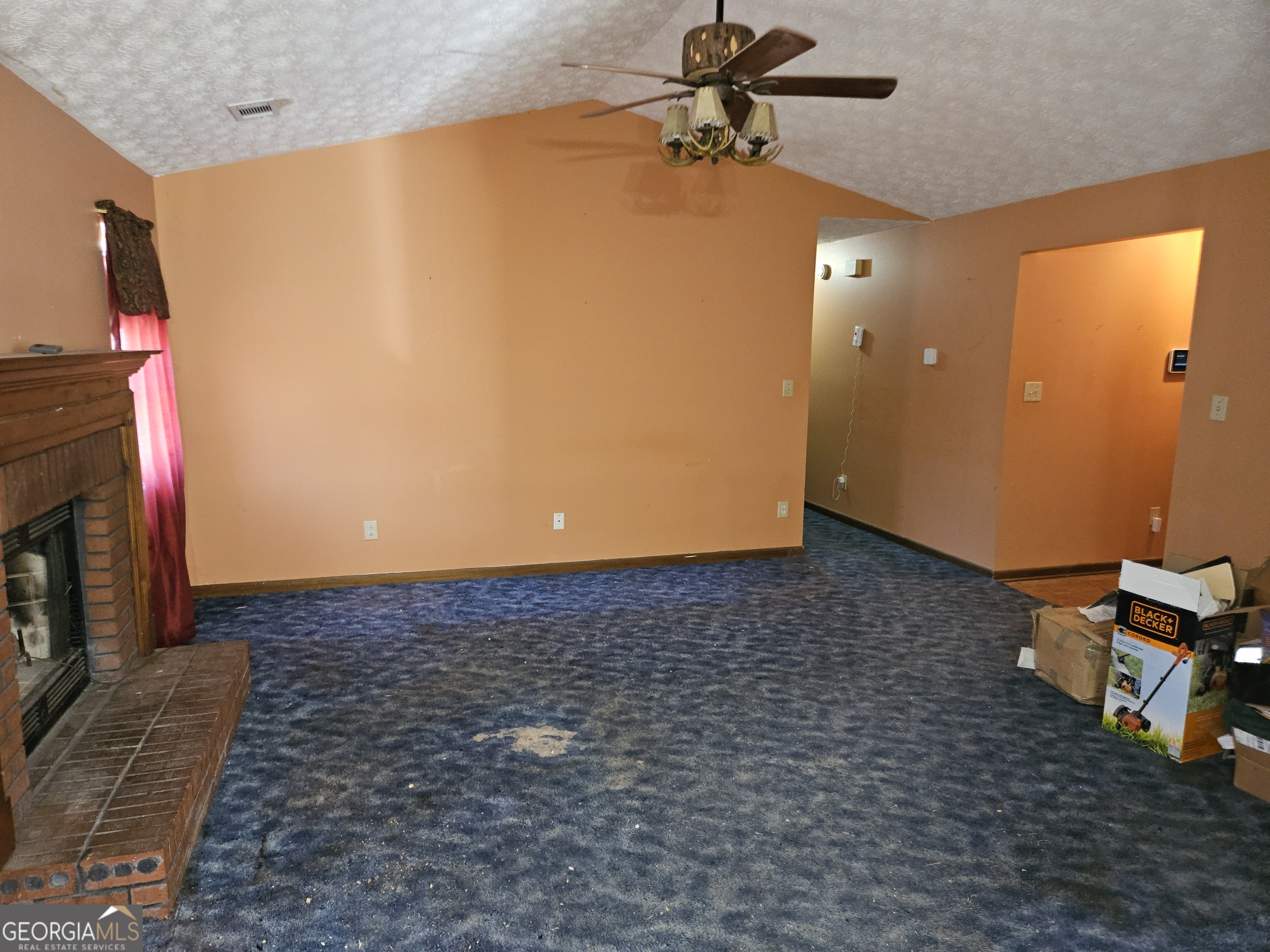 1596 Bonanza Church Road Jonesboro, GA 30236 - Photo 6 of 30 a view of a livingroom with a fireplace