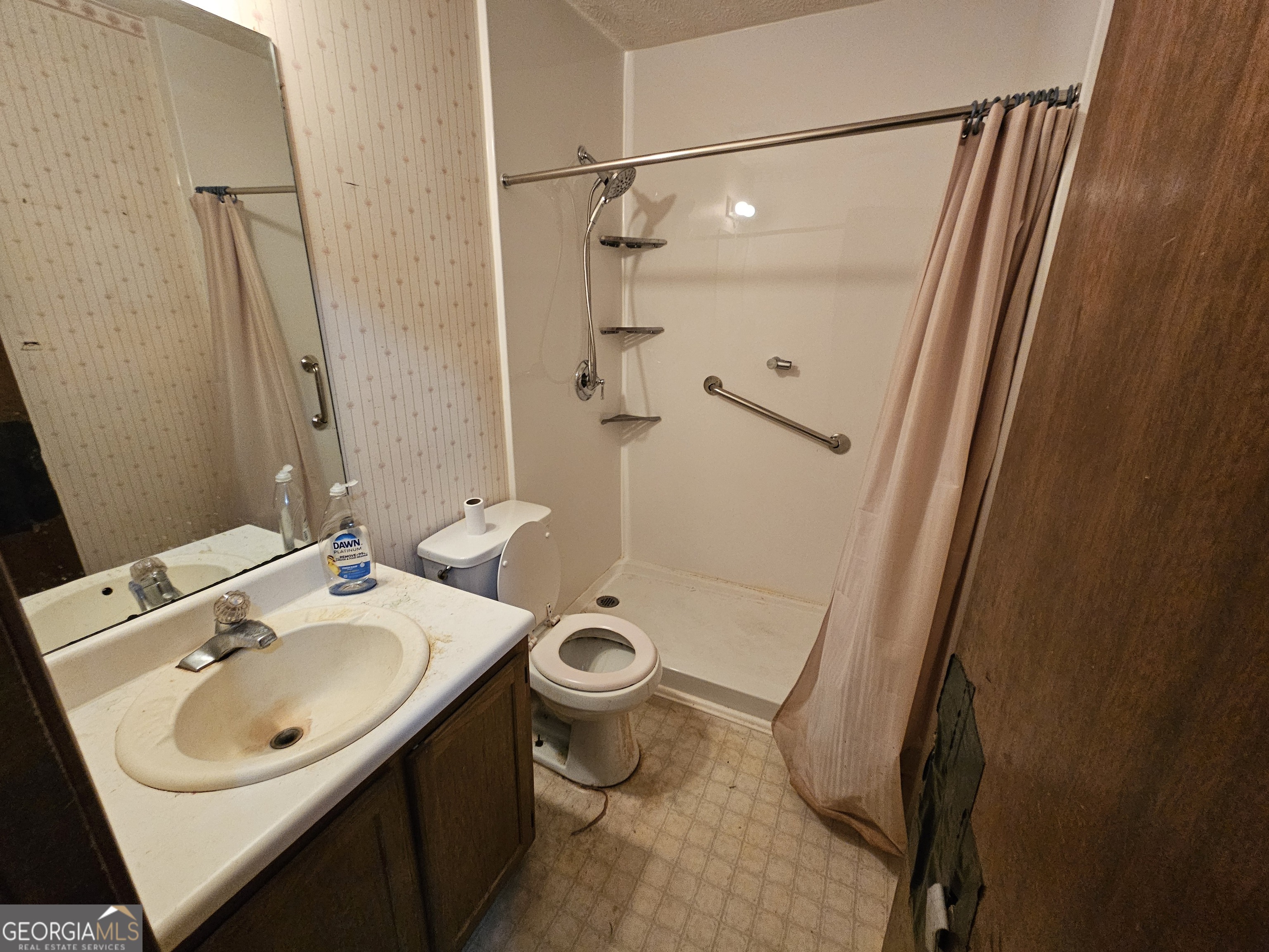 1596 Bonanza Church Road Jonesboro, GA 30236 - Photo 7 of 30 a bathroom with a sink toilet and shower