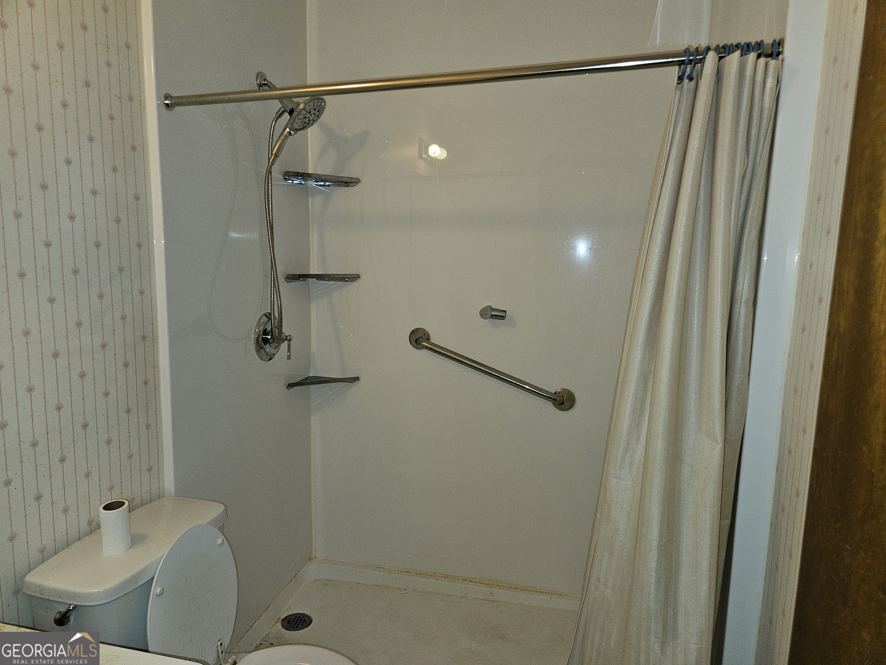 1596 Bonanza Church Road Jonesboro, GA 30236 - Photo 8 of 30 a bathroom with a shower and a mirror