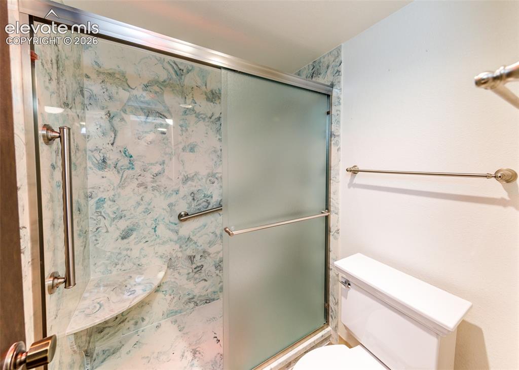 1034 Fontmore Road, Unit D Colorado Springs, CO 80904 - Photo 27 of 43 a bathroom with a shower and a sink