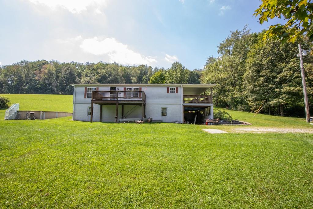 291 Bolden Road Vanderbilt, PA 15486 - Photo 1 of 12 a view of a house with a backyard