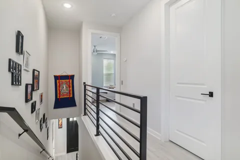 a view of entryway with stairs and wooden floor