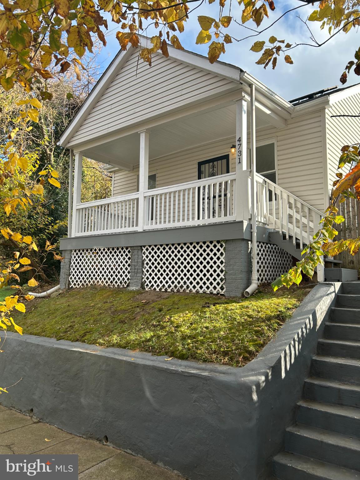 a view of a house with a wooden deck