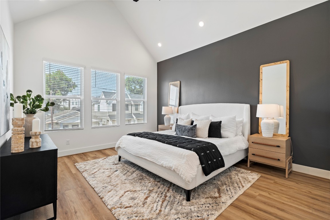 2706 Fox Street Houston, TX 77003 - Photo 19 of 39 a spacious bedroom with a large bed and a couch