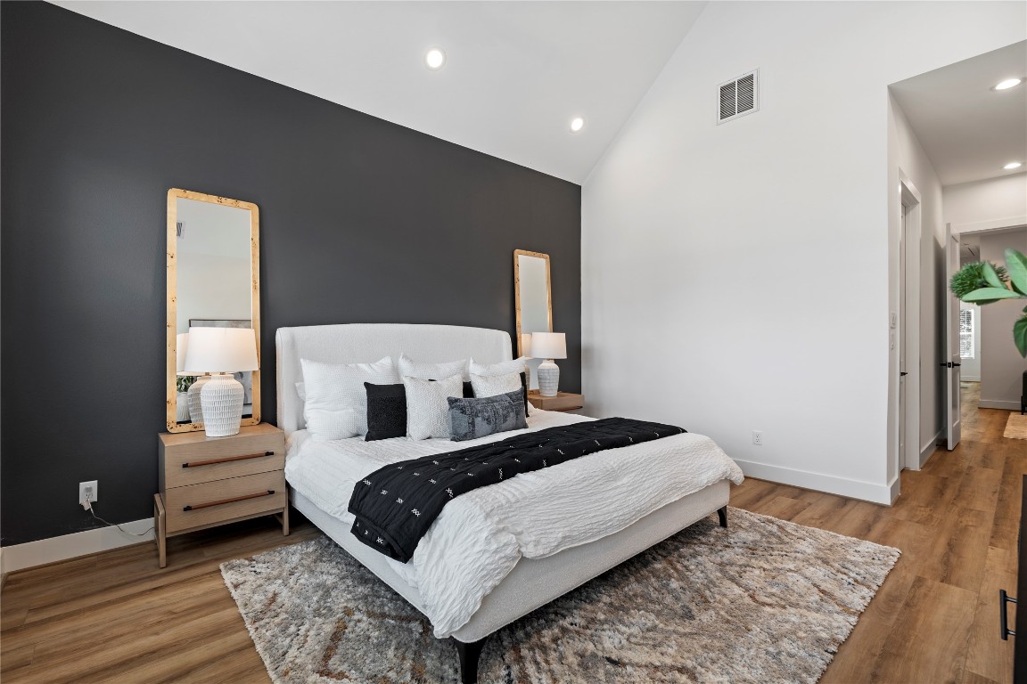 2706 Fox Street Houston, TX 77003 - Photo 20 of 39 a bedroom with a bed and wooden floor