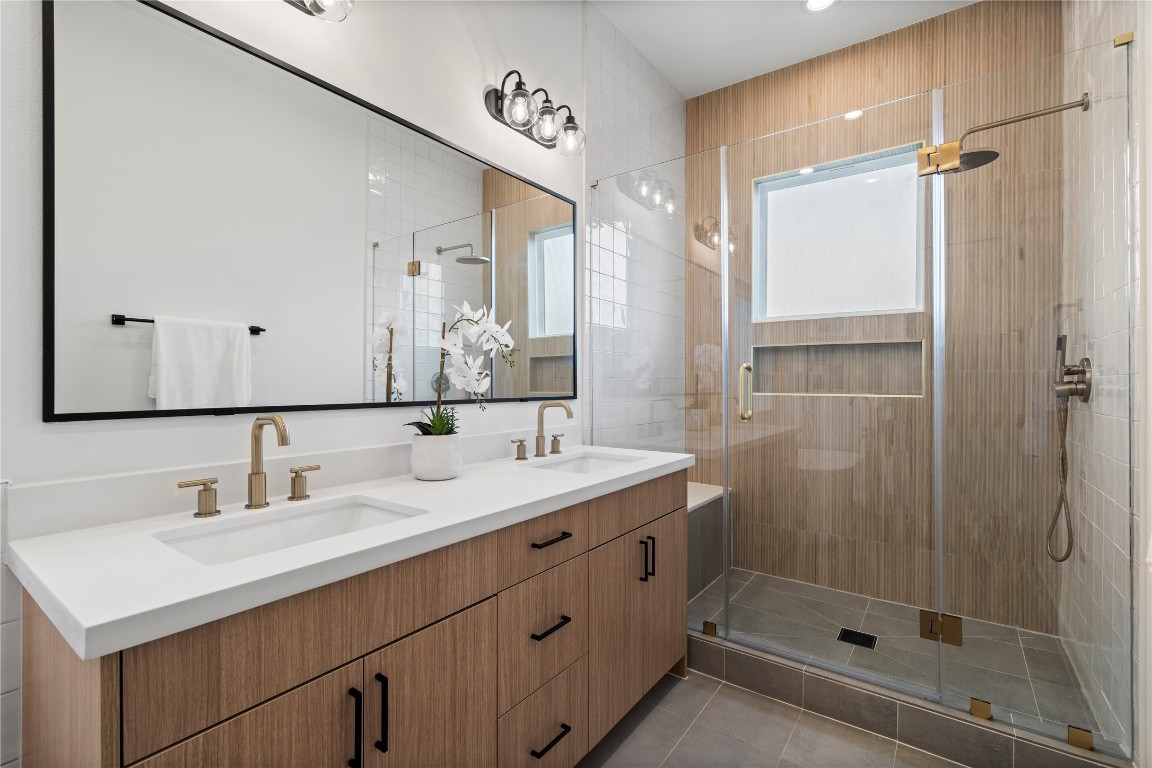 2706 Fox Street Houston, TX 77003 - Photo 23 of 39 a bathroom with a shower sink and mirror
