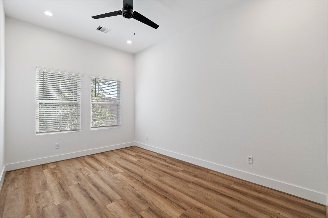 2706 Fox Street Houston, TX 77003 - Photo 29 of 39 an empty room with a window and ceiling fan