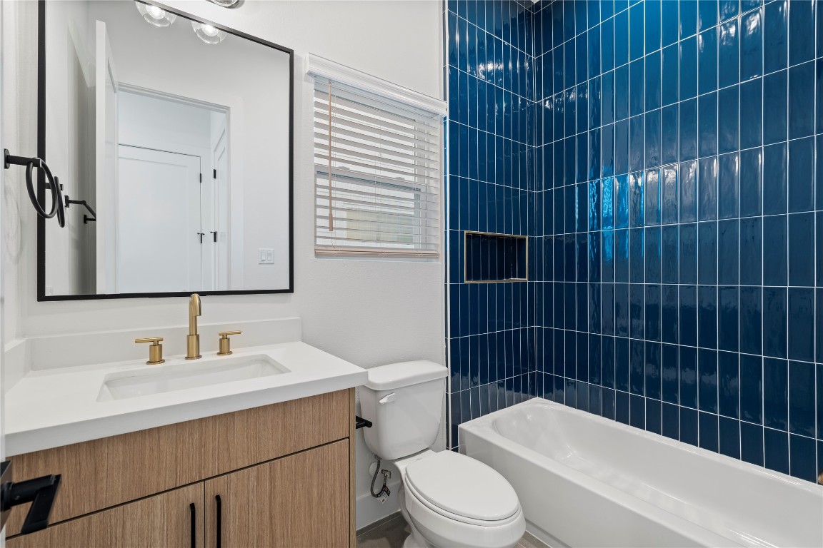 2706 Fox Street Houston, TX 77003 - Photo 31 of 39 a bathroom with a sink toilet vanity and shower