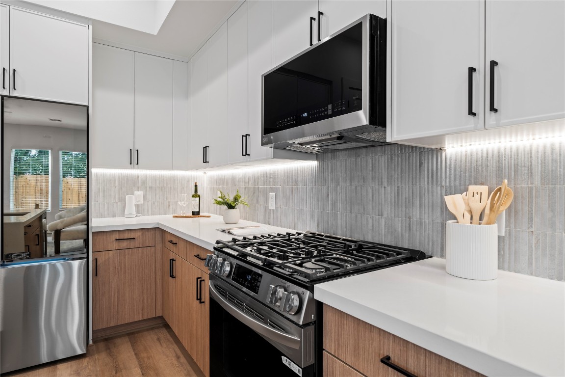 2706 Fox Street Houston, TX 77003 - Photo 9 of 39 a kitchen with a stove and a microwave