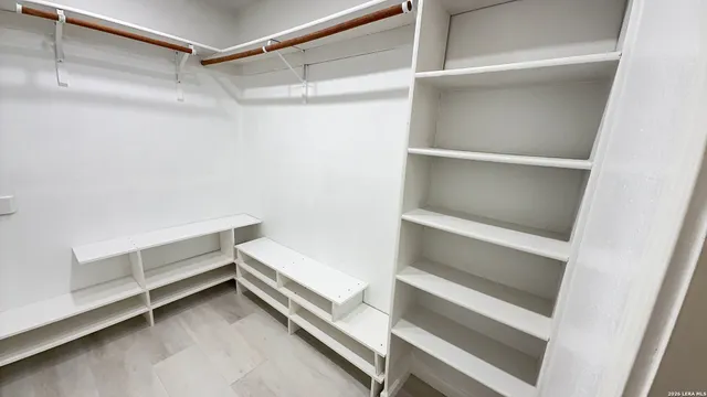 a view of an empty walk in closet