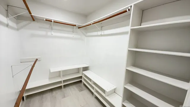 a view of an empty walk in closet
