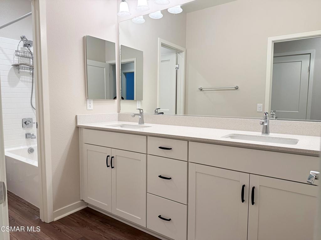 215 Red Brick Drive, Unit 5 Simi Valley, CA 93065 - Photo 18 of 30 a bathroom with double sink and a mirror