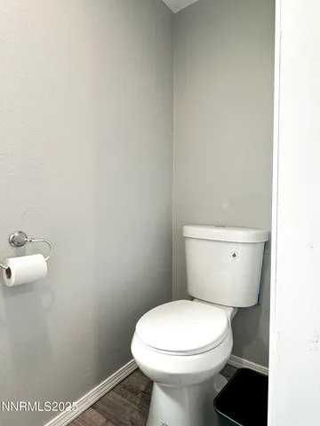 a view of a livingroom with furniture and a flat screen tv