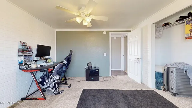 a view of an entryway with wooden floor and a livingroom