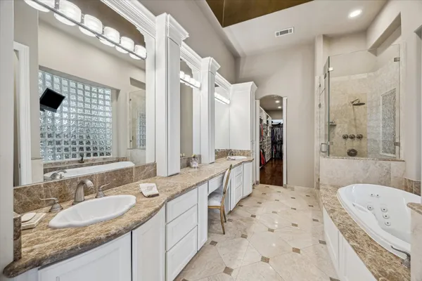a kitchen with a sink appliances and cabinets