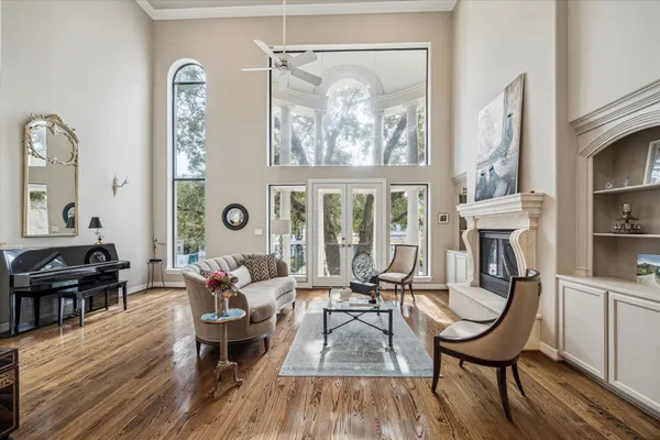 a living room with furniture and a piano