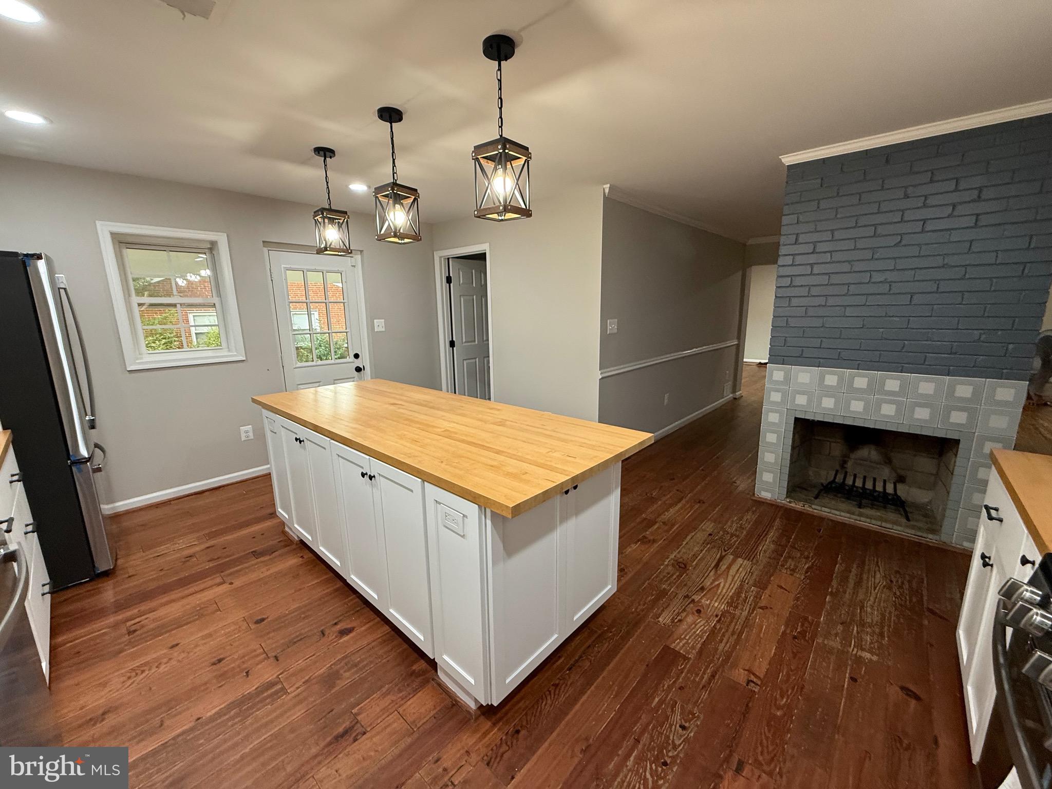 7412 Axton Street Springfield, VA 22151 - Photo 7 of 50 Kitchen + Fireplace