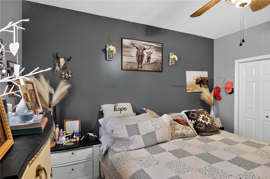 144 Elliott Circle Anderson, SC 29621 - Photo 21 of 30 A comforting bedroom space features a ceiling fan, offering a tranquil retreat.