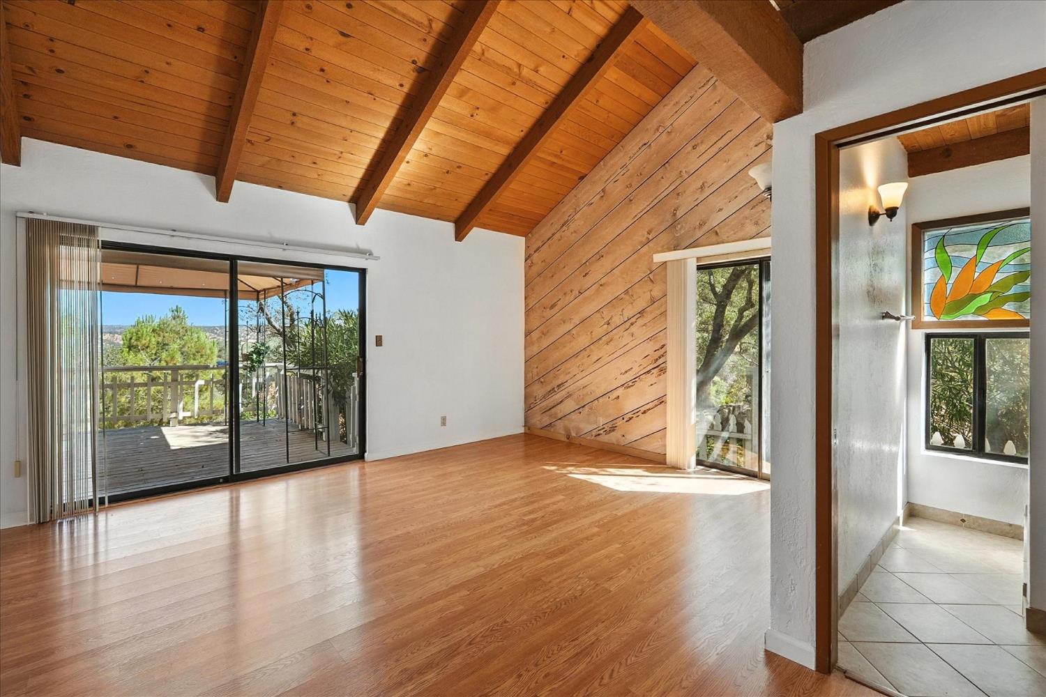 42480 Ranger Cir Way Coarsegold, CA 93614 - Photo 18 of 40 a view of an empty room with wooden floor and a window