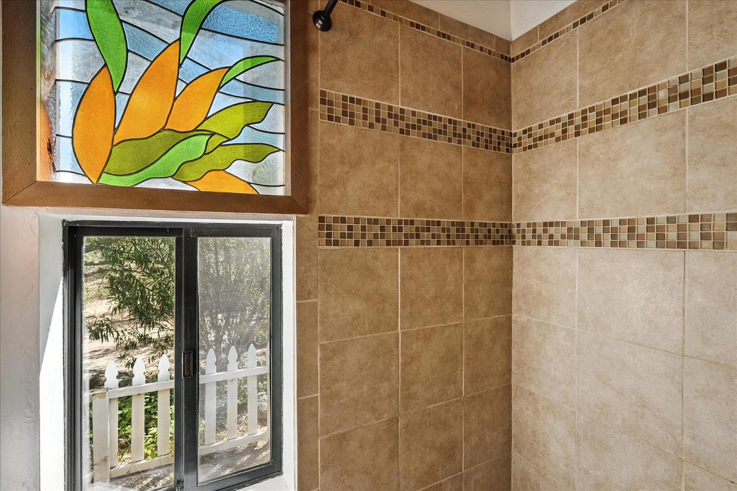 42480 Ranger Cir Way Coarsegold, CA 93614 - Photo 21 of 40 a bathroom with a window and a shower