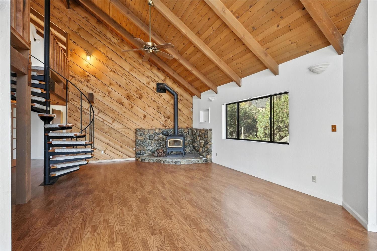 42480 Ranger Cir Way Coarsegold, CA 93614 - Photo 6 of 40 a view of an empty room with stairs and wooden floor