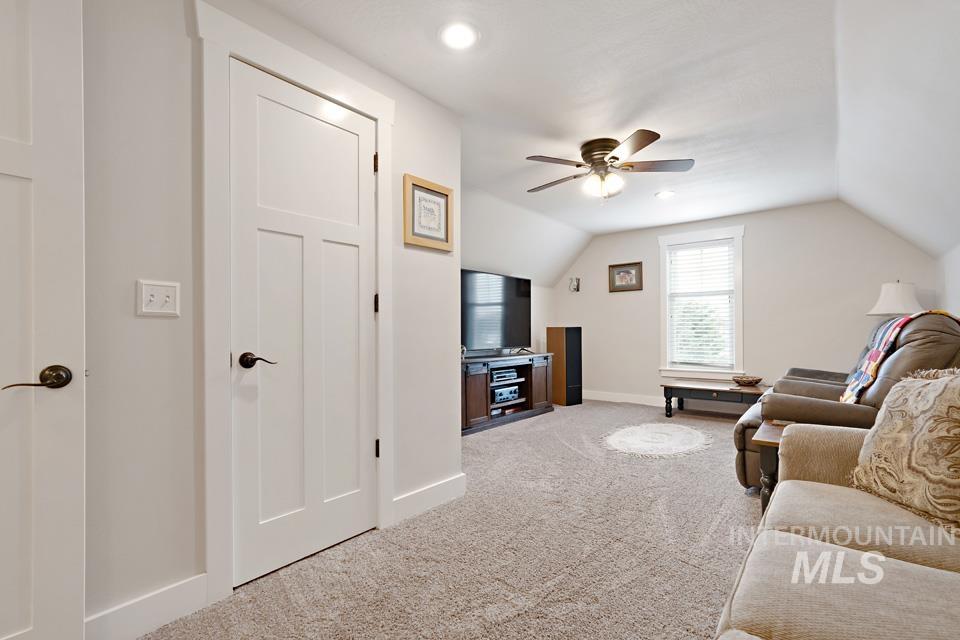 8271 Washoe Road Fruitland, ID 83619 - Photo 28 of 29 Carpeted room featuring a sloped ceiling, recessed lighting, and a window with blinds