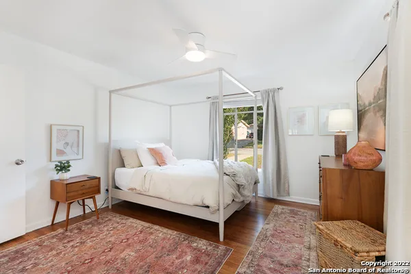 a bed room with a bed and a chair