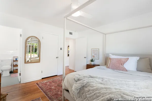 a bedroom with a bed and a closet