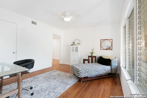 a living room with couch and rug